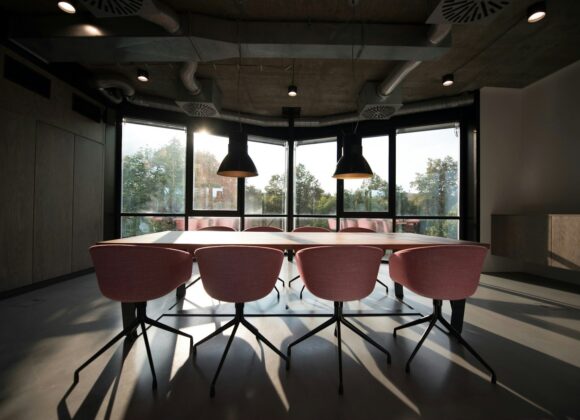 pink dining table with four chairs inside room