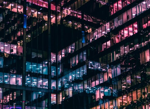 architectural photography of building with people in it during nighttime